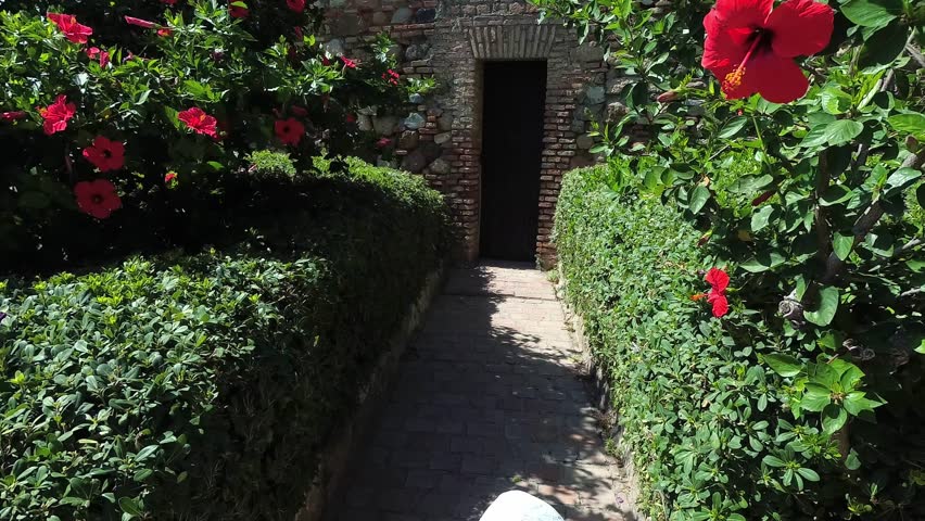 Small girl knocking on old wooden door