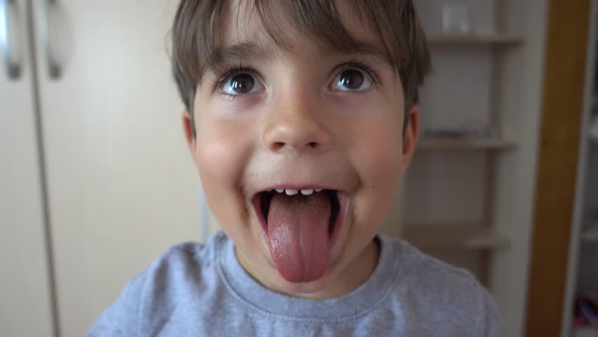 4K Close up Cute face of a kid after eating chocolate