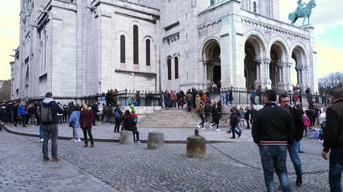 PARIS, FRANCE - MARCH 29, 2018: lot of people walking near the Basilica Sacre Coeur
