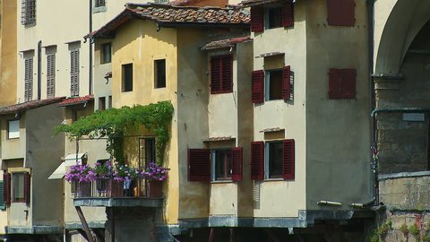 Florence, Tuscany, Italy - July 22 2017 - zoom out from close up of the Ponte Vecchio bridge over the river Arno, Florence Italy,