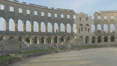 Pula, Croatia - April, 2016: Zoom in view of the arches in the wall at the Roman amphitheater