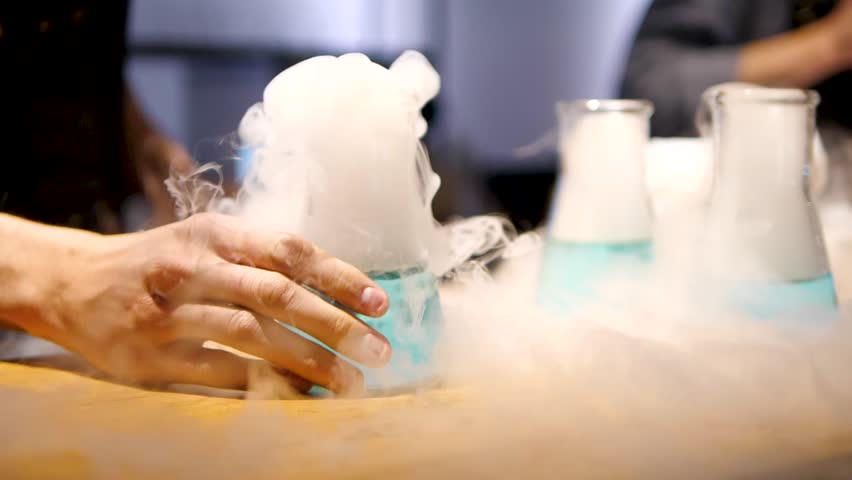 Flask with liquid nitrogen in slow motion Royalty-Free Stock Footage #1011006194
