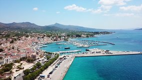 Aerial drone bird's eye view video of picturesque port of Aegina island, Saronic Gulf, Greece