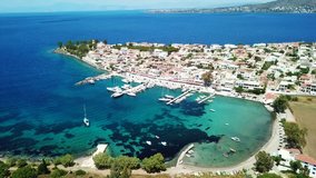 Aerial drone bird's eye view video of port and traditional fishing village of Perdika in island of Aegina, Saronic Gulf, Greece