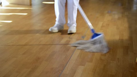 video of unrecognizable cleaning woman cleaning a wooden floor