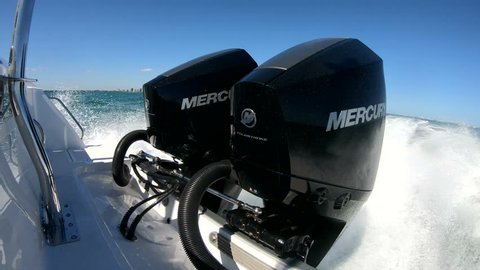 MIAMI – FEBRUARY 18: Brand new Mercury Fourstroke V6 outboard engines mounted on a fishing boat going at full speed on February 18, 2018 in Miami