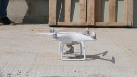 handsome architect flying inspection drone for aerial view of house construction site industry