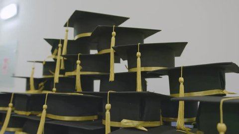 Celebrating academic achievement. Graduation day caps