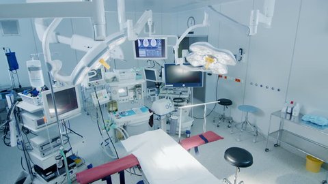 Establishing Shot of Technologically Advanced Operating Room with No People, Ready for Surgery. Real Modern Operating TheaterWith Working Equipment. 