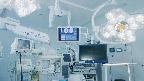 Establishing Shot of Technologically Advanced Operating Room with No People, Ready for Surgery. Real Modern Operating TheaterWith Working Equipment. Shot on RED EPIC-W 8K Helium Cinema Camera.