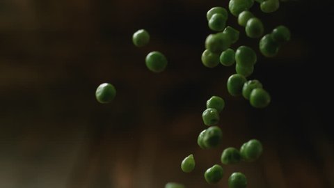 Green peas falling. Shot with high speed camera, phantom flex 4K. Slow Motion.