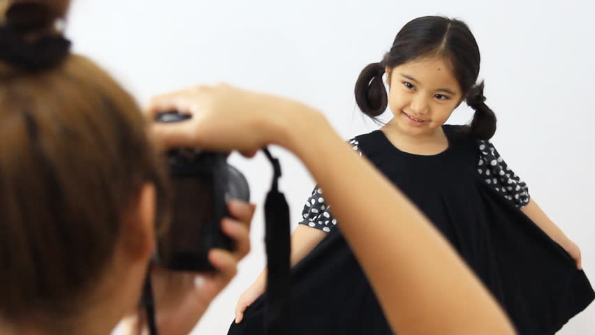 Little Model Kid Posing for Stock Footage Video (100% Royalty-free