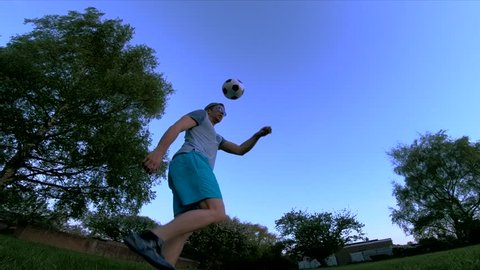 Soccer Football Skills With Urban Hipster Man Practicing Freestyle Skills. A Variety Of 4K Camera Angles Available.