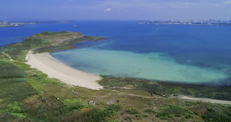 Bautiful white sand of sea bay and Magong City  in Penghu, Taiwan