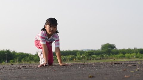 Slow motion: Cute girl running from start point, Health and sport concept