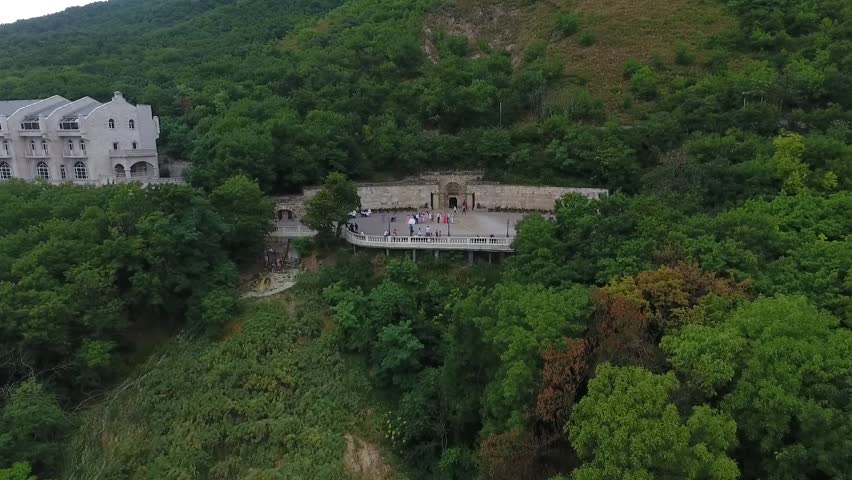 Top to bottom: happy young couple standing on a hill on a summer day. Husband and wife newlyweds relax in a Sunny Park after the wedding. Young man and woman walking in the Park 50 fps