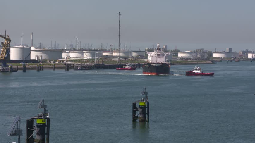 Two tugs assisting bulk carrier Arietta Lily to turn around in Calandkanaal, Europoort. ROTTERDAM SEAPORT - May 2017