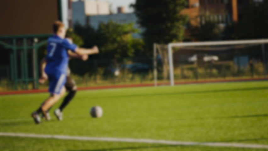 Players try to take away the ball in slow motion, blurred | Shutterstock HD Video #1011087977