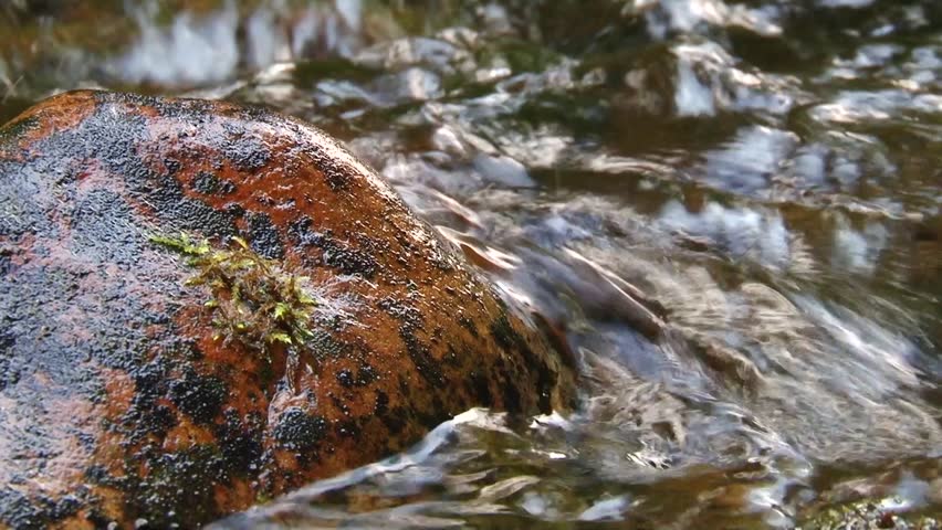 Mountain River water flowing on the stones. 