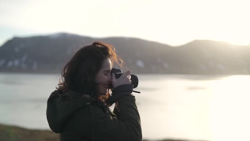 Girl takes a photo of landscapes. Royalty-Free Stock Footage #1011091139