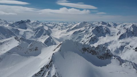 Aerial shot of snow-caped peaks of Alps over Pitztal glacier in Tyrol, Austria