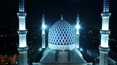 Aerial night view of Sultan Salahuddin Abdul Aziz Shah Mosque (also known as the Blue Mosque) located at Shah Alam, Selangor, Malaysia