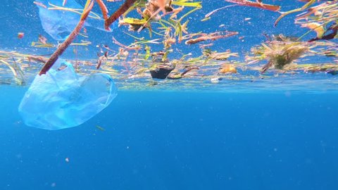 Drifting plastic bag pollution in the ocean surface
