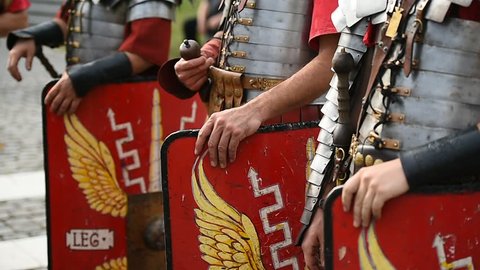 Reenactment detail with roman soldiers uniforms from the thirteen Gemina legion