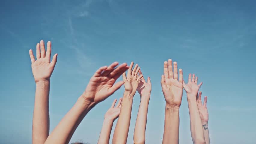 People rasing hands on blue sky background. Voting, democracy or volunteering concept | Shutterstock HD Video #1011147110