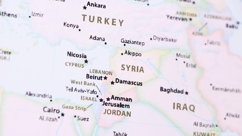 Syria on a political map of the world. Video defocuses showing and hiding the map.