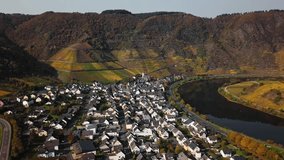 Flight over autumn Bremm vineyards and Mosel river, Germany.