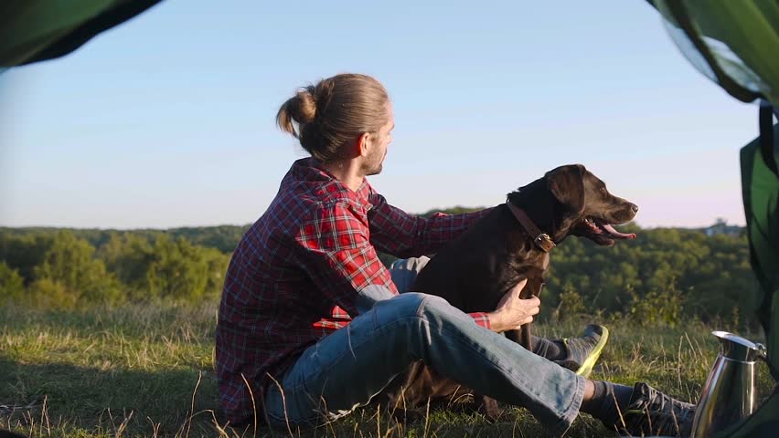 Man Traveling With Dog, Camping In Nature.