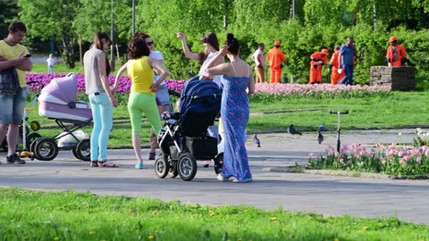 Moscow, Russia - May 15. 2018. mothers with strollers walk along boulevard in Zelenograd