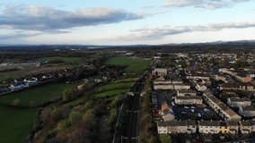 Aerial drone footage of suburban houses and fields in Scotland, UK 