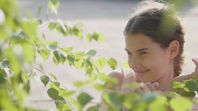 portrait beautiful little girl Russia twig birch tree leaves lifestyle summer slow motion video emotion