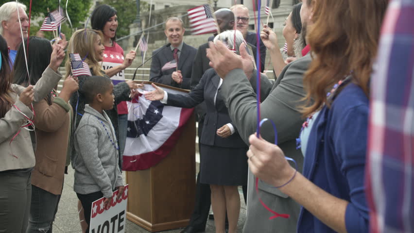A politician shaking hands with her supporters | Shutterstock HD Video #1011175967