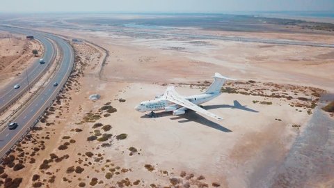 4K aerial video of an old abandoned airplane in Emirates. Flying over