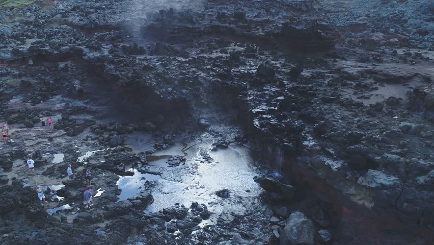 Aerial of Hawaii cliffs, coastline and mountains near Honolulu.