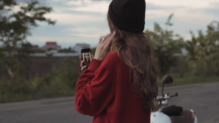 Girl in red sweater make selfie on phone outdoor | Shutterstock HD Video #1011195080
