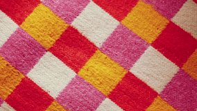 Closeup shot of colorful plaid cotton textile. Checkered shirt fabric. Can be used as abstract background.