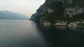 Panorama of the gorgeous Lake Garda surrounded by mountains, Italy. video shooting with drone