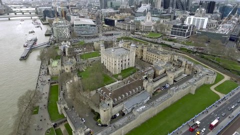 Aerial Bird Eye View Tower of London Her Majesty's Royal Palace and Fortress Historic Iconic Building in England, UK.  History around a Medieval Castle is a Famous Tourist Destination Landmark 4K - HD