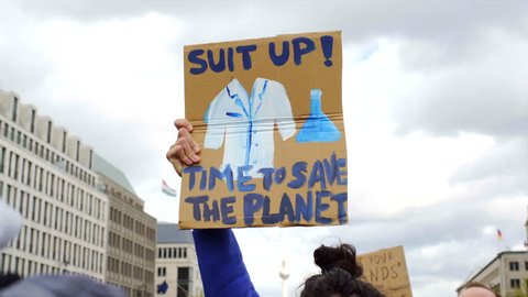 Suit up, time to save the planet, climate change, March for Science sign, Berlin
