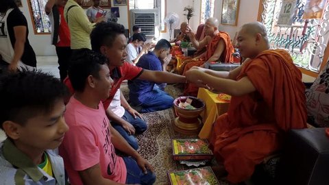 PENANG, MALAYSIA - APRIL 13, 2018: Buddhist religious ritual during Songkran festival at Dharmikarama Burmese Temple.