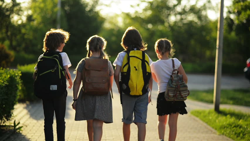 Group of Pupils with School Backpacks Are Going Back to School. They Are Having a Lot of Fun. Royalty-Free Stock Footage #1011208871