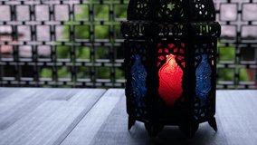Ramadhan or Eid lantern with candle on table top