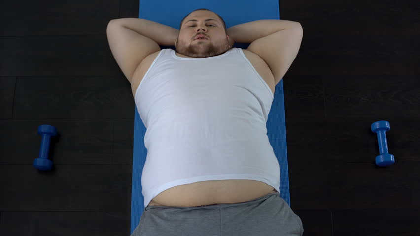 Lazy Overweight Man Doing Situps Resting Stock Footage Video 100