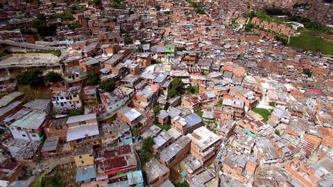 Medellin, Colombia, aerial view of Comuna 13 slums. Once one of the most dangerous neighbourhoods in Colombia, the Comuna 13 reinvented itself in recent times and is now considered safe to visit.