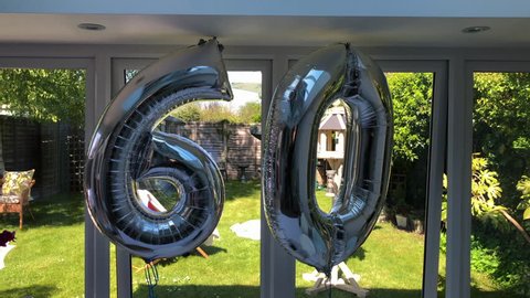 60th Birthday celebration part balloons silver metallic