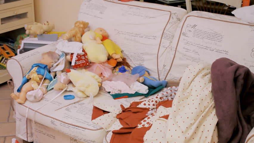 An odd couple (actors in character as kids): a guy and a girl kissing on a sofa, getting surprised by something we don